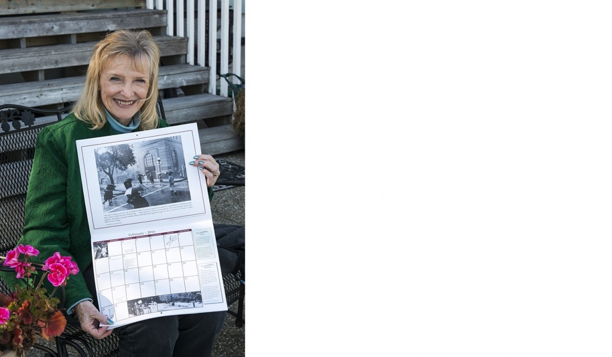 Karolyn “Zuzu” Grimes displays different pages from the calendar.  February 2016